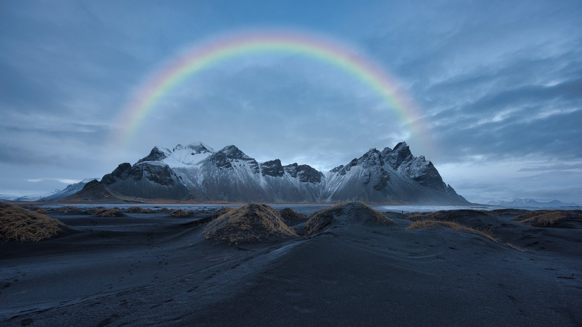 Photo of a mountain with a beautiful rainbow